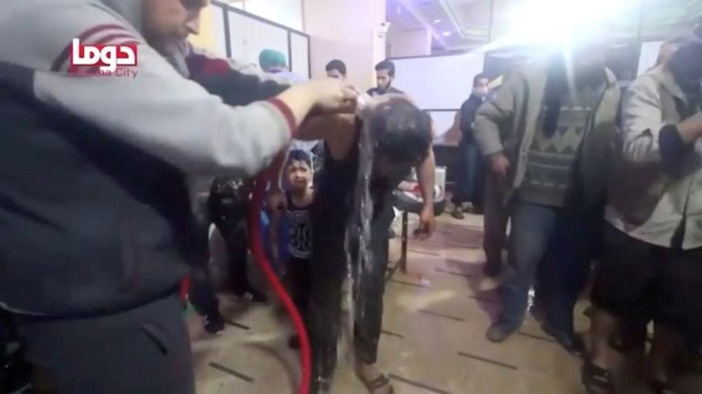 A man is washed following alleged chemical weapons attack, in what is said to be Douma, Syria in this still image from video obtained by Reuters on April 8, 2018. White Helmets/Reuters TV via REUTERS THIS IMAGE HAS BEEN SUPPLIED BY A THIRD PARTY.