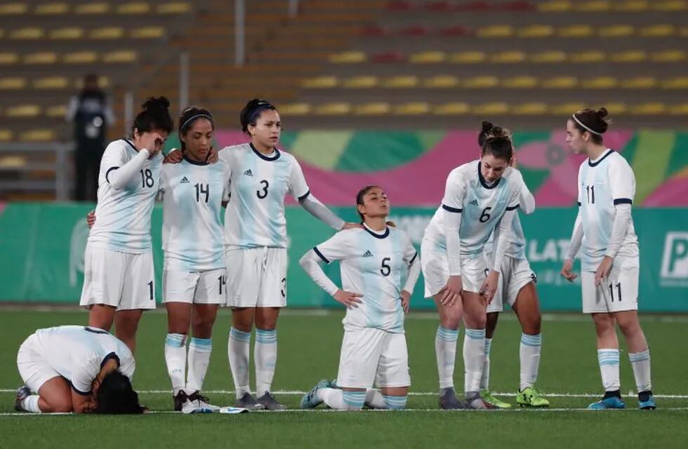 Soccer Football - XVIII Pan American Games - Lima 2019 - Women's Finals - Argentina vs Colombia - San Marcos Stadium, Lima, Peru - August 9, 2019. Argentina's players react after the penalty shootout. REUTERS/Susana Vera