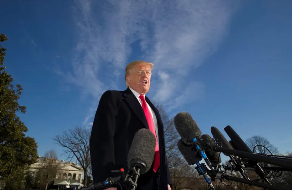 President Donald Trump speaks on the South Lawn of the White House as he walks from Marine One, Sunday, Jan. 6, 2019, in Washington. Trump returned from a trip to Camp David. (AP Photo/Alex Brandon)