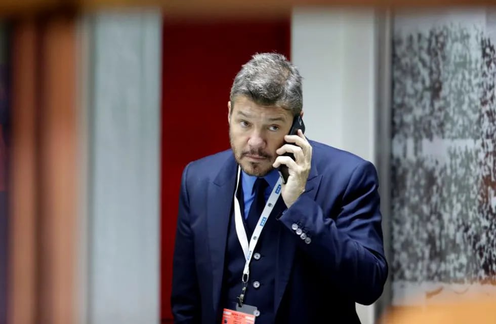 TV host, media producer and businessman Marcelo Tinelli speaks on the phone before a 2018 Russia World Cup qualifying soccer match between Argentina and Chile at the Monumental stadium in Buenos Aires, Argentina, Thursday March 23, 2017.(AP Photo/Victor R