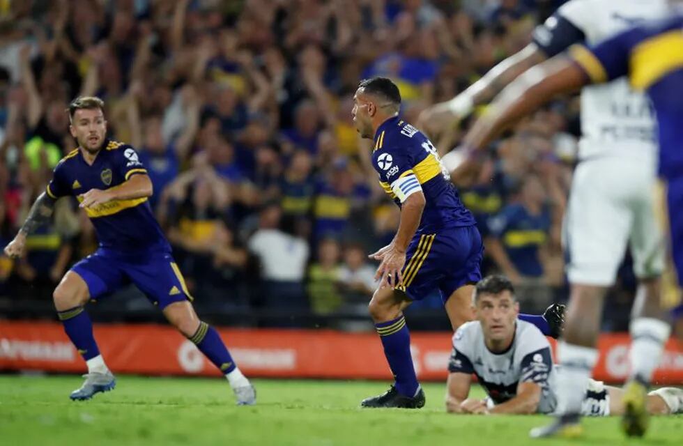 Boca Juniors' Carlos Tevez celebrates after scoring the opening goal during an Argentina's soccer league match against Gimnasia y Esgrima at La Bombonera stadium in Buenos Aires, Argentina, Saturday, March 7, 2020. (AP Photo/Natacha Pisarenko)