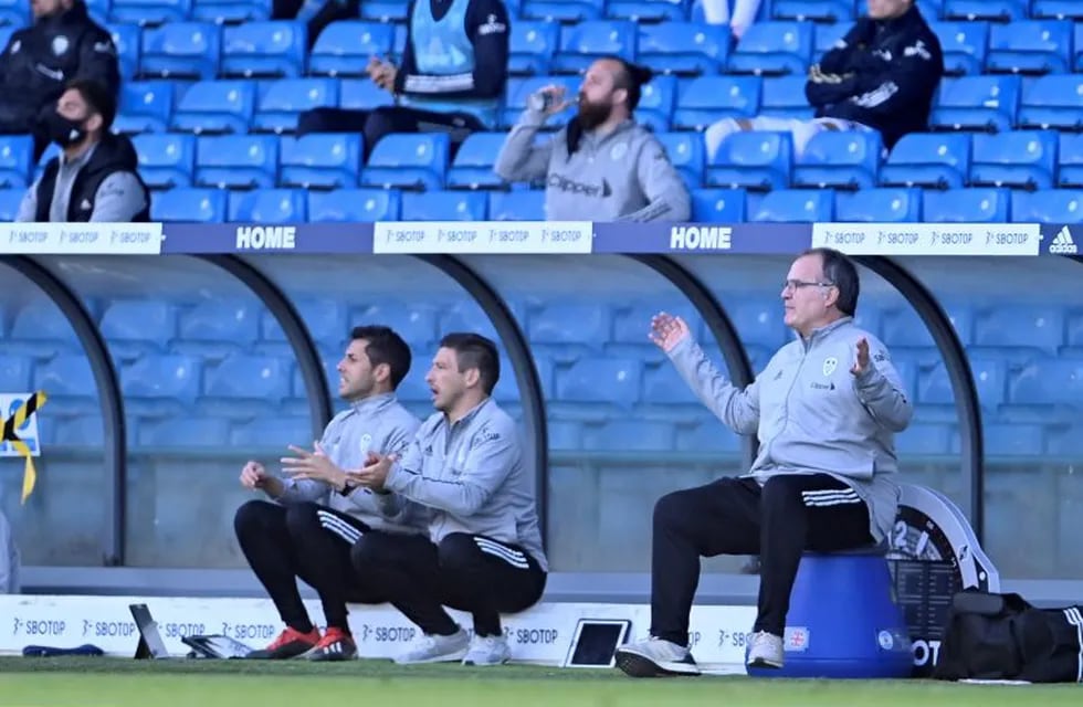 Leeds United's head coach Marcelo Bielsa, right, reacts during the English Premier League soccer match between Leeds United and Fulham at Elland Road Stadium, in Leeds, England, Saturday, Sept. 19, 2020. (Laurence Griffiths/Pool via AP)