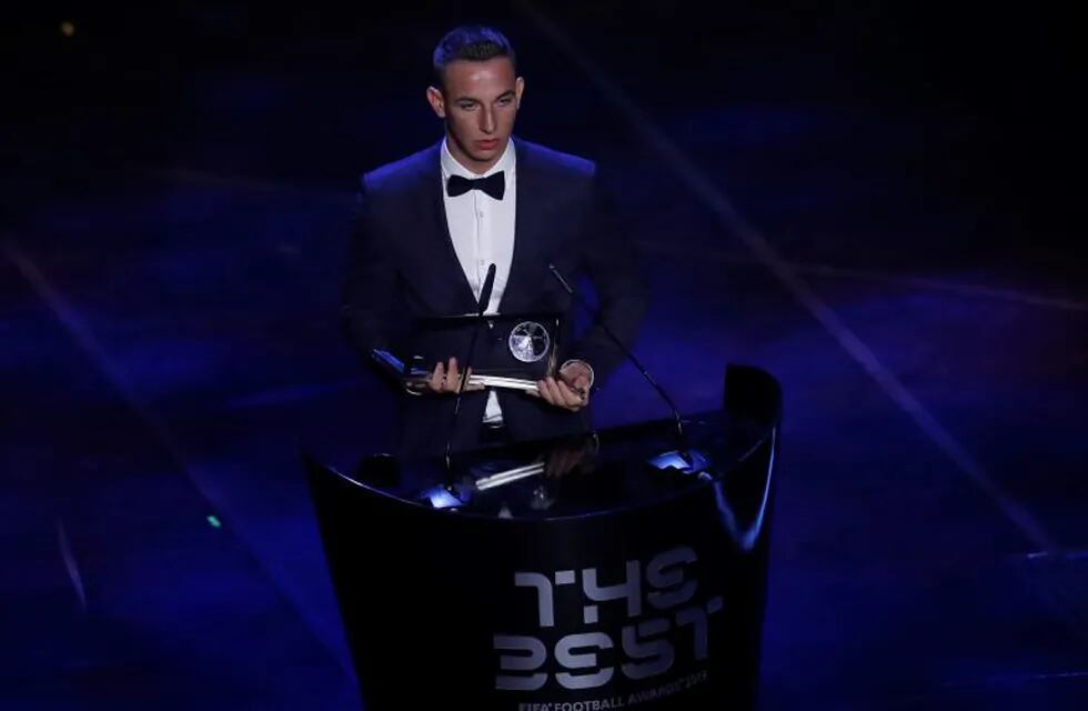 Hungarian player Daniel Zsori receives the FIFA Puskas Award 2019 for the best goal during the ceremony of the Best FIFA Football Awards, in Milan's La Scala theater, northern Italy, Monday, Sept. 23, 2019. . (AP Photo/Antonio Calanni)