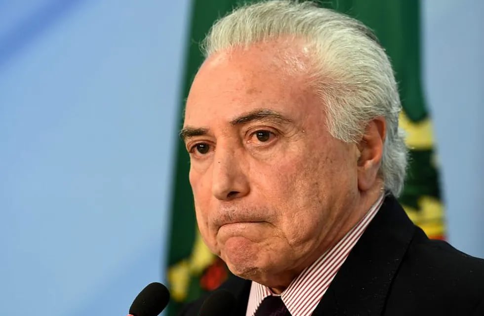 Michel Temer anunciando a Ivan Monteiro como nuevo presidente de Petrobras (AFP).