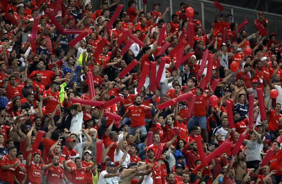 Supporters of Argentinian Independiente cheer for their team during the Recopa Sudamericana 2018 second leg final match against Brazil's Gremio held at Arena Gremio, in Porto Alegre, Brazil, on February 21, 2018. / AFP PHOTO / ITAMAR AGUIAR