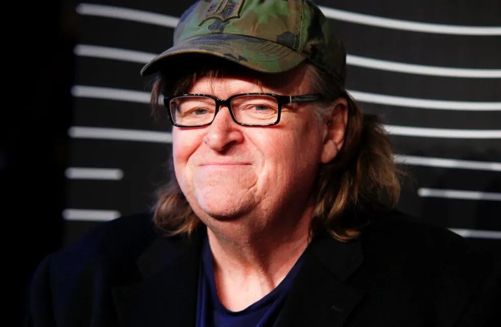 FILE - In this May 16, 2016 file photo, Michael Moore attends the 20th Annual Webby Awards at Cipriani Wall Street in New York. Moore premiered a surprise film about the U.S. presidential election on Tuesday, Oct. 18, 2016. 