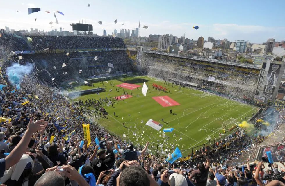 FILE - In this May 4, 2008 file photo, Boca Juniors fans cheer prior to an Argentine soccer league game against River Plate at La Bombonera stadium in Buenos Aires. Peruvian football officials have on Monday, Sept. 11, 2017, asked FIFA to shift the World Cup qualifier against Argentina next month from Boca Junior's Bombonera stadium. (AP Photo/Daniel Luna, File)