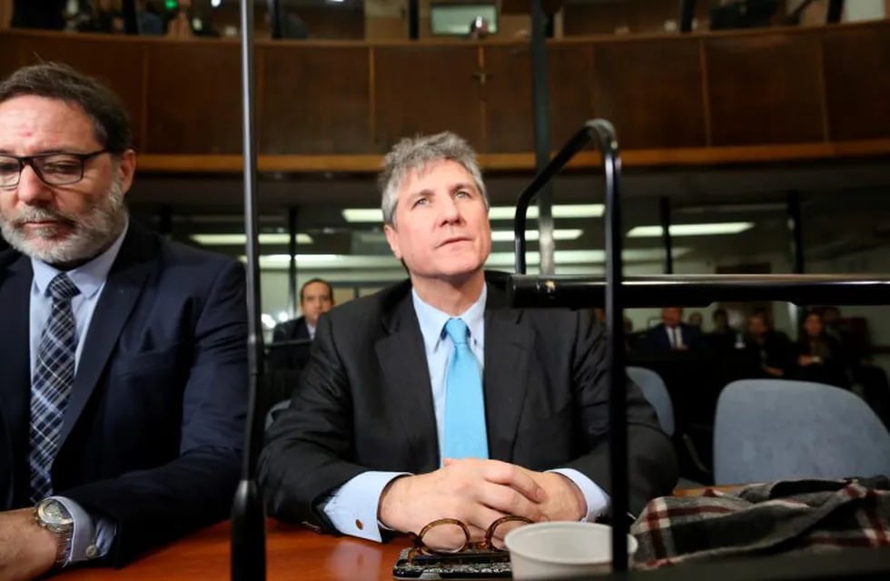 FILE - In this Aug. 7, 2018 file photo, Argentina's former Vice President Amado Boudou, right, and his lawyer Alejandro Rua sit in court in Buenos Aires, Argentina before Boudou was sentenced to five years and 10 months in prison for bribery and conducting business incompatible with public office. On Tuesday, Dec. 11, 2018, a court in Argentina released Boudou from prison under bail, saying that the sentence is not firm since it is still being appealed. (AP Photo/Sebastian Pani, File)  amado boudou alejandro rua