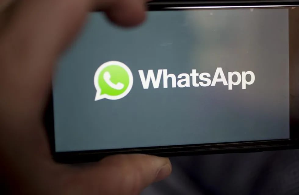The Facebook Inc. WhatsApp logo is displayed on an Apple Inc. iPhone in an arranged photograph taken in Arlington, Virginia, U.S. on Monday, April 29, 2019. Facebook paid out a $123 million fine to EU antitrust regulators for failing to provide accurate information during their review of Facebook's WhatsApp takeover. Photographer: Andrew Harrer/Bloomberg