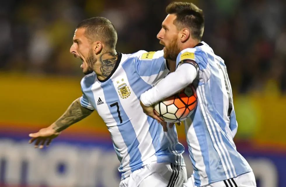 Argentina's Lionel Messi (R) celebrates with teammate Dario Benedetto after scoring against Ecuador during their 2018 World Cup qualifier football match in Quito, on October 10, 2017. / AFP PHOTO / Pablo COZZAGLIO