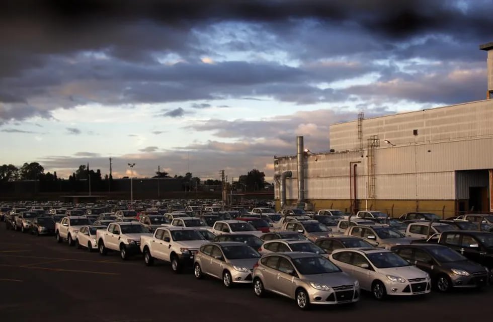 New Ford vehicles are seen at a parking lot of the Ford factory in Pacheco, on the outskirts of Buenos Aires, May 22, 2014. After a decade of growth, Argentina faces a sharp decline this year as industrial output falls and one of the world's highest infla