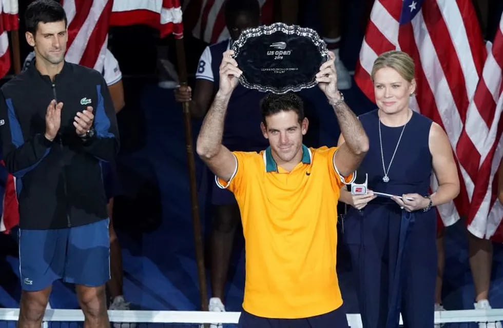 Juan Martin del Potro of Argentina holds the second place trophy after playing Novak Djokovic of Serbia during their 2018 US Open men's singles final match on September 9, 2018 in New York. (Photo by kena betancur / AFP)