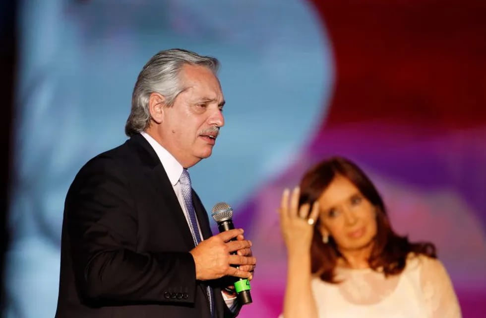 (FILES) In this file photo taken on December 10, 2019, Argentina's new President Alberto Fernandez (L) speaks to his supporters next to Vice-President Cristina Fernandez de Kirchner (R) during the inauguration ceremony at Plaza de Mayo square in Buenos Aires. - A month into his presidency, Alberto Fernandez has embarked on an ambitious and risky juggling act in a bid to drag Argentina out of its worsteconomic crisis in almost 20 years and avoid a default. (Photo by Emiliano Lasalvia / AFP)