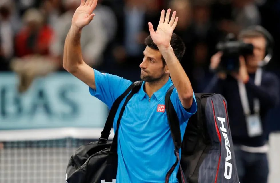 Novak Djokovic of Serbia waves goodbye as he leave the central couts after he lost against Marin Cilic of Croatia in the quarterfinal match of the Paris Masters tennis tournament at the Bercy Arena in Paris, Friday, Nov. 4, 2016. Cilic won 6-4, 7-6. (AP Photo/Michel Euler)