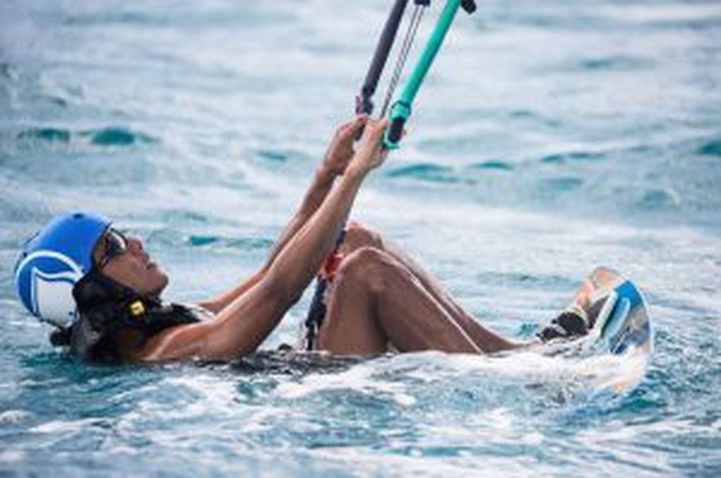 Former U.S. President Barack Obama tries his hand at kite surfing during a holiday with British businessman Richard Branson on his island Moskito, in the British Virgin Islands, in a picture handed out by Virgin on February 7, 2017. Jack Brockway/Virgin H