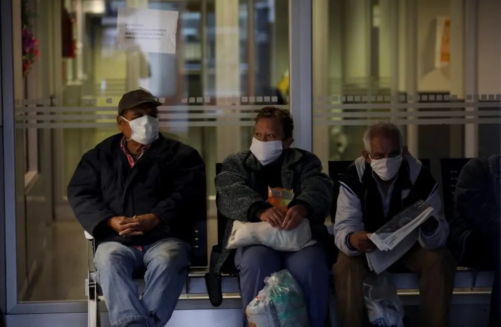 Patients wait to be attended at a hospital during a government-ordered lockdown to curb the spread of the new coronavirus in Buenos Aires, Argentina, Tuesday, April 28, 2020. (AP Photo/Natacha Pisarenko)