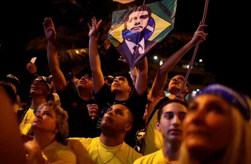 Supporters of Jair Bolsonaro, far-right lawmaker and presidential candidate of the Social Liberal Party (PSL), react during a runoff election in Sao Paulo, Brazil October 28, 2018. REUTERS/Nacho Doce