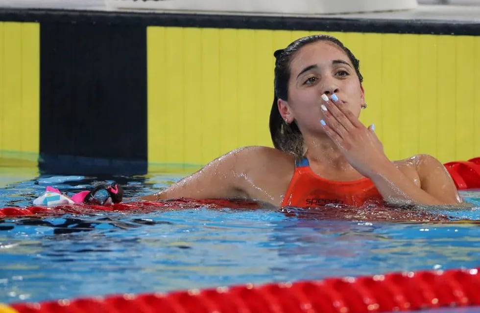 Argentina's Delfina Pignatiello celebrates after winning gold in the women's swimming 1500m freestyle final at the Pan American Games in Lima, Peru, Saturday, Aug. 10, 2019. (AP Photo/Rebecca Blackwell)