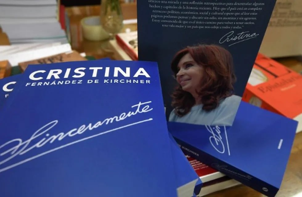 A man holds a copy of Argentina's former president and current senator Cristina Fernandez de Kircher's book \