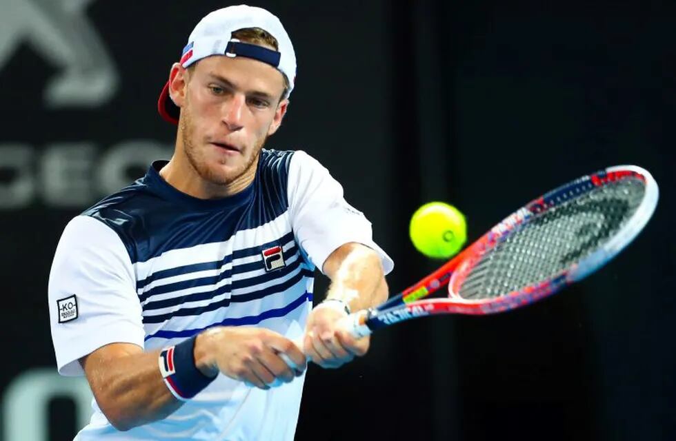 Diego Schwartzman of Argentina hits a return to Alexandr Dolgopolov of Ukraine during their first round match at the Brisbane International tennis tournament in Pat Rafter Arena, Brisbane on December 31, 2017. AFP PHOTO / Patrick HAMILTON. IMAGE RESTRICTED TO EDITORIAL USE - STRICTLY NO COMMERCIAL USE / AFP PHOTO / Patrick HAMILTON / -- IMAGE RESTRICTED TO EDITORIAL USE - STRICTLY NO COMMERCIAL USE --