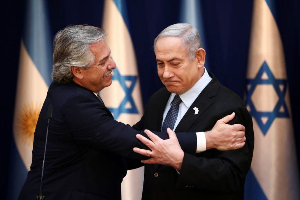 Israeli Prime Minister Benjamin Netanyahu, right, and Argentina's President Alberto Fernandez sake hands during their meeting in Jerusalem, Friday, Jan. 24, 2020. (AP Photo/Oded Balilty,pool)