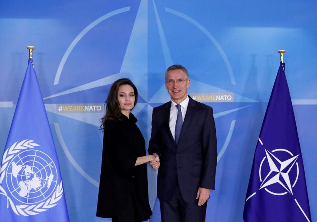UNHCR Special Envoy actor Angelina Jolie is welcomed by NATO Secretary General Jens Stoltenberg at the Alliance's headquarters in Brussels, Belgium, January 31, 2018. REUTERS/Yves Herman
