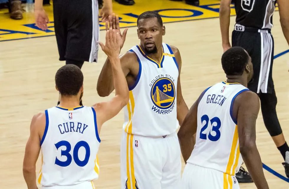 May 16, 2017; Oakland, CA, USA; Golden State Warriors guard Stephen Curry (30) high fives forward Kevin Durant (35) after a basket against the San Antonio Spurs during the second quarter in game two of the Western conference finals of the NBA Playoffs at Oracle Arena. Mandatory Credit: Kelley L Cox-USA TODAY Sports