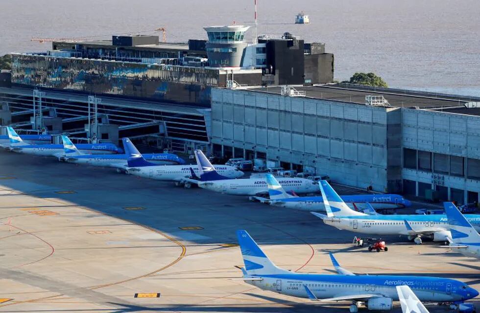 FILE PHOTO: Aerolineas Argentinas' passenger planes are seen parked at Jorge Newbery domestic airport, as the spread of the coronavirus disease (COVID-19) continues, in Buenos Aires, Argentina April 29, 2020. REUTERS/Agustin Marcarian/File Photo  aeroparque jorge newbery