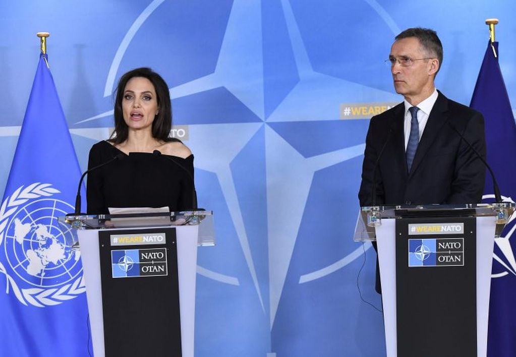 US actress and Special Envoy for the United Nations High Commissioner for Refugees (UNHCR) Angelina Jolie (L) addresses a press conference after meeting with NATO Secretary General Jens Stoltenberg (R) on January 31, 2018.    / AFP PHOTO / Emmanuel DUNAND