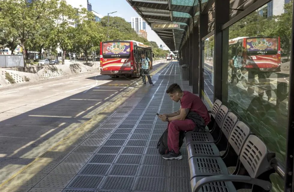 Passengers wait at a bus station in Buenos Aires, Argentina, on Friday, March 20, 2020. Argentina imposed a nationwide lockdown to stem the coronavirus pandemic, marking one of the strictest measures taken by any Latin American nation. Photographer: Sarah Pabst/Bloomberg