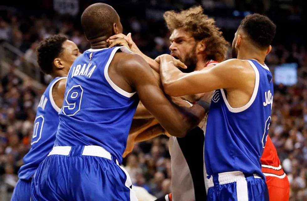 Mar 21, 2017; Toronto, Ontario, CAN; A fight breaks out between Toronto Raptors forward Serge Ibaka (9) and Chicago Bulls center Robin Lopez (8) at the Air Canada Centre. Toronto defeated Chicago 122-120 in overtime. Mandatory Credit: John E. Sokolowski-U