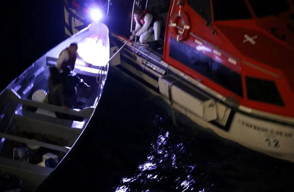 Two Costa Rican fishermen, who spent 20 days adrift at sea, are rescued onto a lifeboat from the Royal Caribbean cruise ship Empress of the Seas, near Grand Cayman and Jamaica December 20, 2018, in this picture obtained from social media. Jared Eberle/via REUTERS THIS IMAGE HAS BEEN SUPPLIED BY A THIRD PARTY. MANDATORY CREDIT. NO RESALES. NO ARCHIVES.