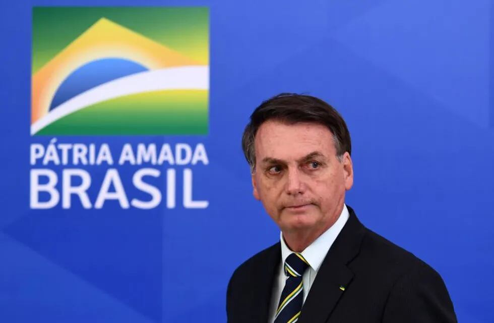 (FILES) In this file picture taken on April 24, 2020 Brazil's President Jair Bolsonaro arrives for a press conference in Brasilia, on April 24, 2020. - Brazilian supreme court judge Celso de Mello on April 27, 2020 ordered an investigation into accusations by ex-justice and security minister Sergio Moro that President Jair Bolsonaro sought to \