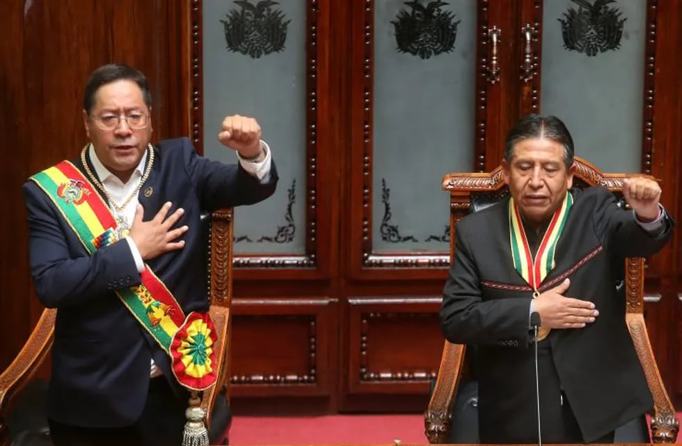 Bolivia's new President Luis Arce, left, and Vice President David Choquehuanca sing the national anthem on their inauguration day at Congress in La Paz, Bolivia, Sunday, Nov. 8, 2020. (AP Photo/Jorge Mamani)