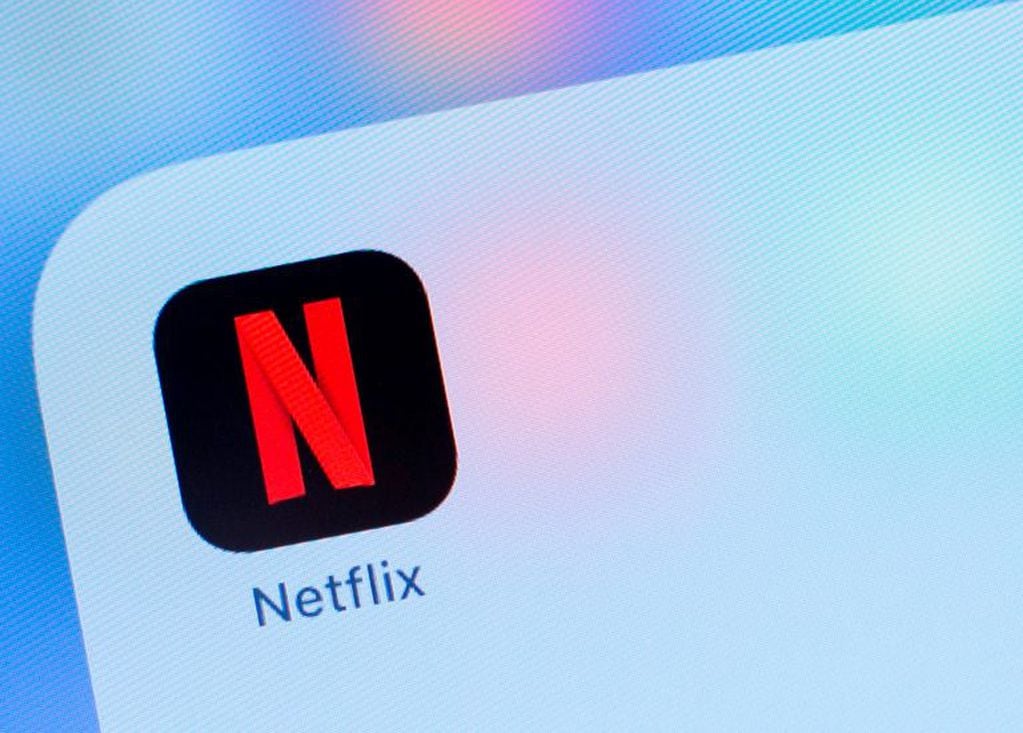 (FILES) In this file photo taken on July 10, 2019, the Netflix logo is seen on a phone in this photo illustration in Washington, DC. - Netflix shares plunged more than 10 percent in after-hours trade on July 17, 2019, after its quarterly update showed weaker-than-expected subscriber growth for the streaming television sector leader. Netflix said it added 2.7 million new subscribers worldwide in the April-June period, well below expectations, as the sector prepared for offerings from rival groups including Walt Disney, Apple and others. (Photo by Alastair Pike / AFP)