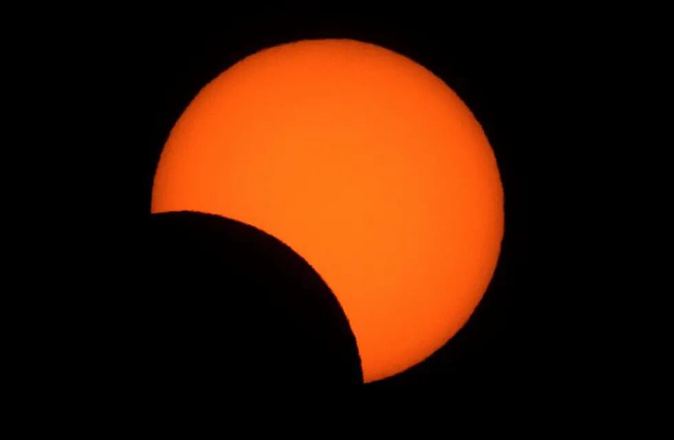 Solar eclipse as seen from Congreso neighborhood in the city of Buenos Aires, Argentina, on July 2, 2019. - Tens of thousands of tourists braced Tuesday for a rare total solar eclipse that was expected to turn day into night along a large swath of Latin America's southern cone. (Photo by ALEJANDRO PAGNI / AFP)