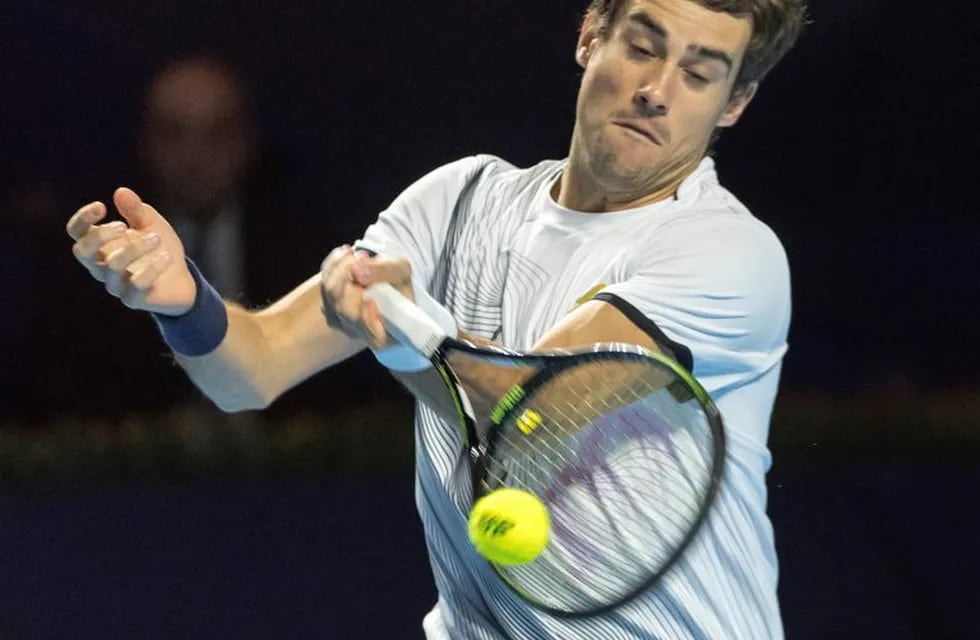 Argentina's Guido Pella returns a ball to France's Richard Gasquet during their first round match at the Swiss Indoors tennis tournament at the St. Jakobshalle in Basel, Switzerland, Wednesday, Oct. 26, 2016. (Georgios Kefalas/Keystone via AP)