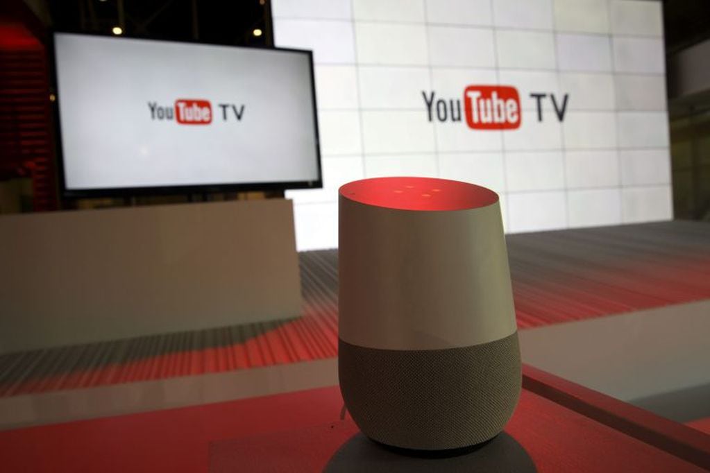 A Google Inc. Home device is displayed in front of YouTube Inc. signage during the company's unveiling of a new television subscription service at the YouTube Space LA venue in Los Angeles, California, U.S., on Tuesday, Feb. 28, 2017. For $35 a month, sta