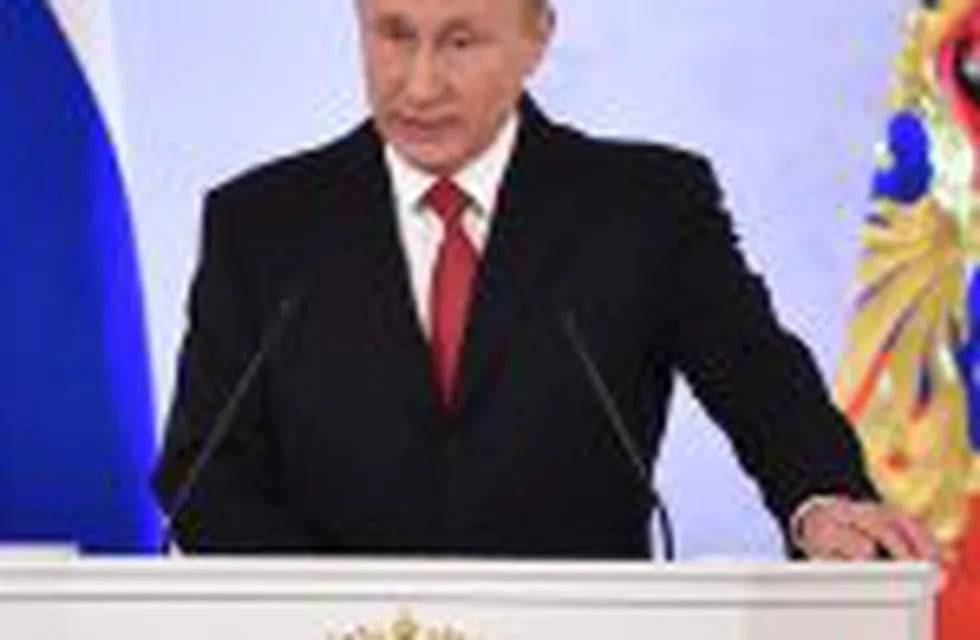 (FILES) This file photo taken on December 1, 2016 shows Russian President Vladimir Putin addressing the Federal Assembly of both houses of parliament at the Kremlin in Moscow.nVladimir Putin was the world's most powerful person for a fourth straight year in 2016, with US president-elect Donald Trump in second place, Forbes magazine said December 14, 2016 in its annual rankings. 