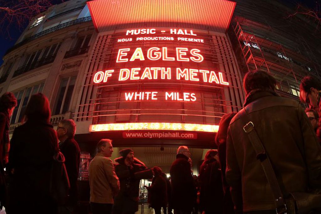TOPSHOT - A picture taken with a fisheye lens shows people standing outside the Olympia concert venue in Paris, a few hours ahead of a concert by US rock group Eagles of Death Metal, on February 16, 2016. Eagles of Death Metal, the Californian rock group 