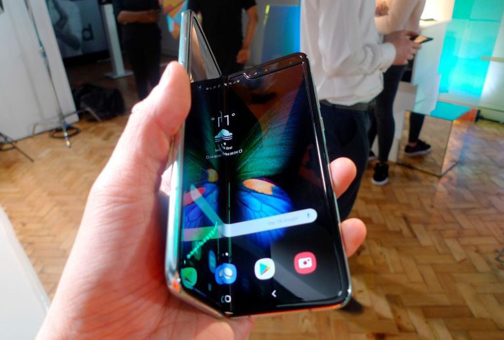 The Samsung Galaxy Fold smartphone is seen during a media preview event in London, Tuesday April 16, 2019.  Samsung is hoping the innovation of smartphones with folding screens reinvigorates the market. (AP Photo/Kelvin Chan)