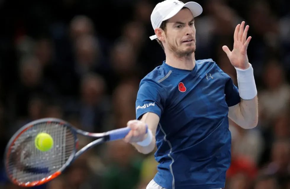 Britain's Andy Murray returns the ball to John Isner of the United States during the final of the Paris Masters tennis tournament at the Bercy Arena in Paris, Sunday, Nov. 6, 2016. Murray won 6-3, 7-6, 6-4. (AP Photo/Michel Euler)