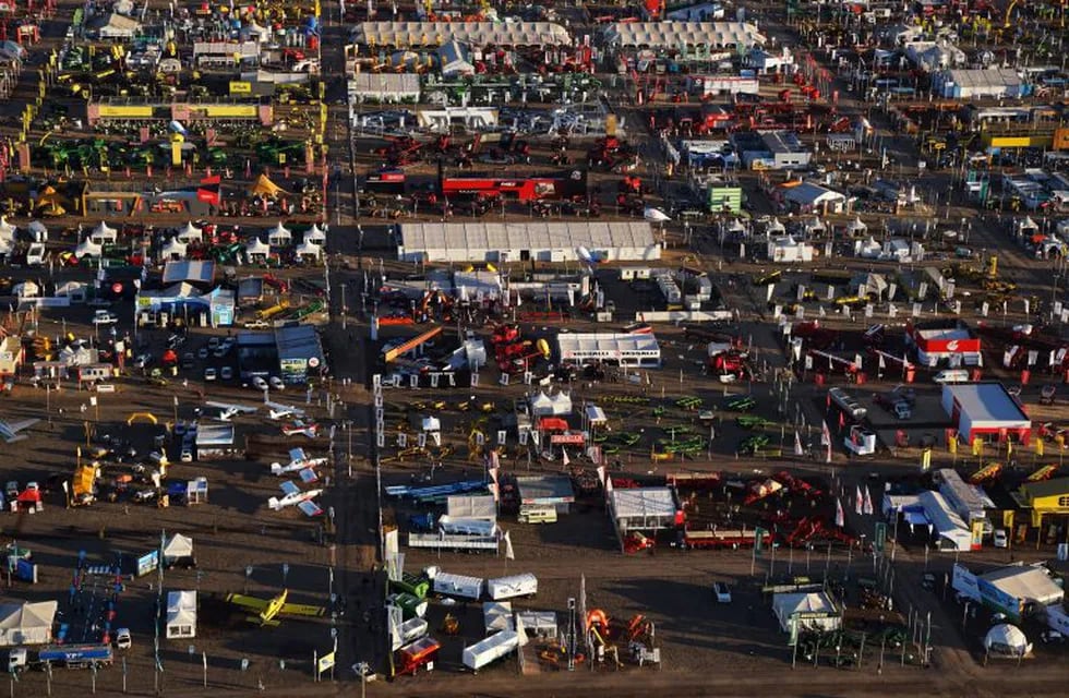 Vendor tents and farm machinery are seen in this aerial photograph during the AgroActiva fair above Armstrong, Santa Fe, Argentina, on Thursday, June 1, 2017. YPF SA, the state-run oil company, is generating about $1.4 billion in annual revenue from agriculture, just as Argentina's farm industry is being encouraged to crank up production. Photographer: Pablo E. Piovano/Bloomberg Santa Fe  feria AgroActiva feria agropecuaria AgroActiva