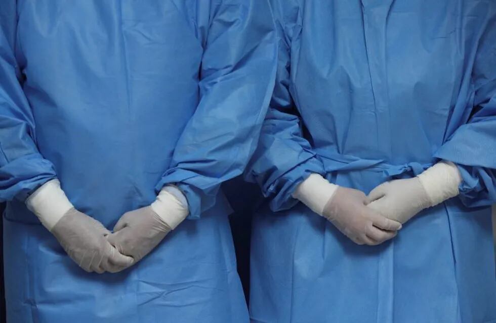 Nurses wearing scrubs stand in a small medical center that specializes in respiratory illnesses as they wait to attend patients amid the spread of the new coronavirus in Lima, Peru, Wednesday, March 11, 2020. The vast majority of people recover from the new coronavirus. (AP Photo/Martin Mejia)