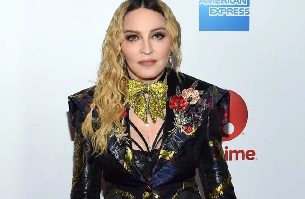 FILE - This Dec. 9, 2016 file photo shows Madonna at the 11th annual Billboard Women in Music honors in New York. On Monday, the Hollywood Reporter announced that Universal had acquired the rights to u201cBlond Ambition,u201d a script about the singer. On Tuesday, Madonna expressed her displeasure via an Instagram post. She said that only she was qualified to tell her story and u201canyone else who tries is a charlatan and a fool.u201d (Photo by Evan Agostini/Invision/AP, File)