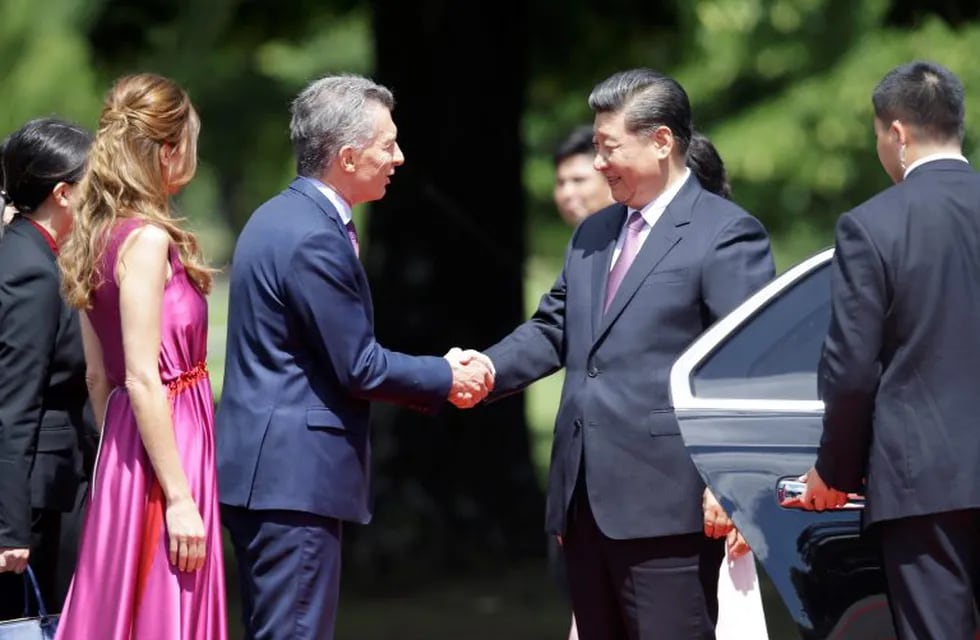 Argentina's President Mauricio Macri and first lady Juliana Awada welcome China's President Xi Jinping at presidential residence in Olivos, a northern suburb of Buenos Aires, Argentina, Sunday, Dec. 2, 2018. (AP Photo/Martin Mejia)