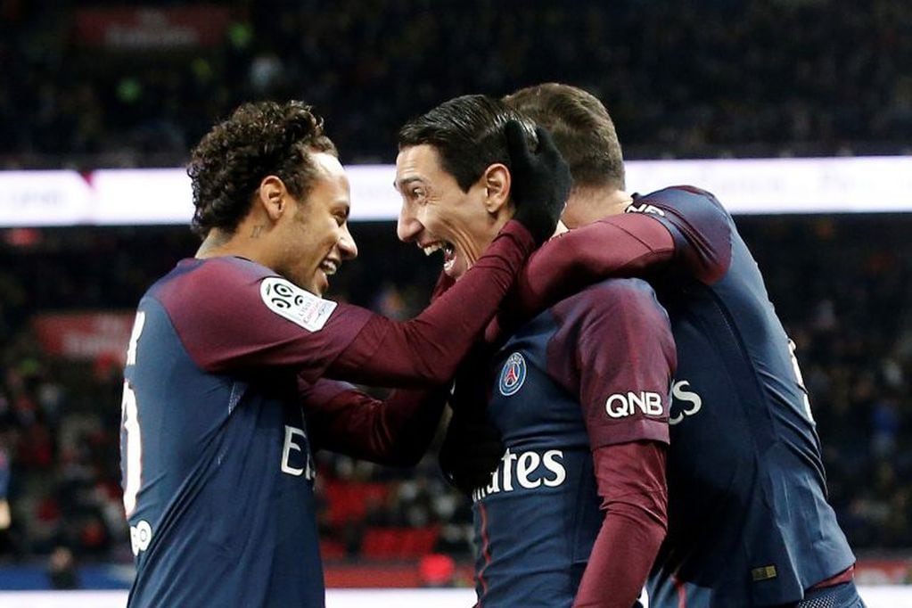 PSG's Angel Di Maria, center right, celebrates with PSG's Neymar, after scoring during his French League One soccer match between Paris-Saint-Germain and Dijon, at the Parc des Princes stadium in Paris, France, Wednesday, Jan.17, 2018. (AP Photo/Thibault Camus)