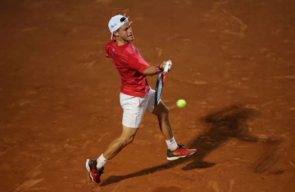 Argentina's Diego Schwartzman plays a forehand to Canada's Denis Shapovalov in their semi final match of the Men's Italian Open at Foro Italico in Rome on September 20, 2020. (Photo by Clive Brunskill / various sources / AFP)