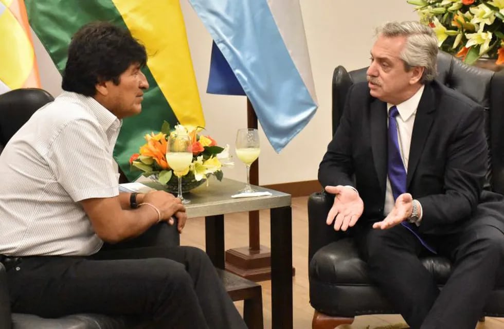 In this photo courtesy of Bolivia's Communication Ministry press office, Bolivia's President Evo Morales, left, speaks with Argentina's Presidential candidate Alberto Fernandez, during a photo opportunity in Santa Cruz, Bolivia, Thursday, Sept. 19, 2019.  (Raul Martinez/Bolivia's Communication Ministry press office via AP)