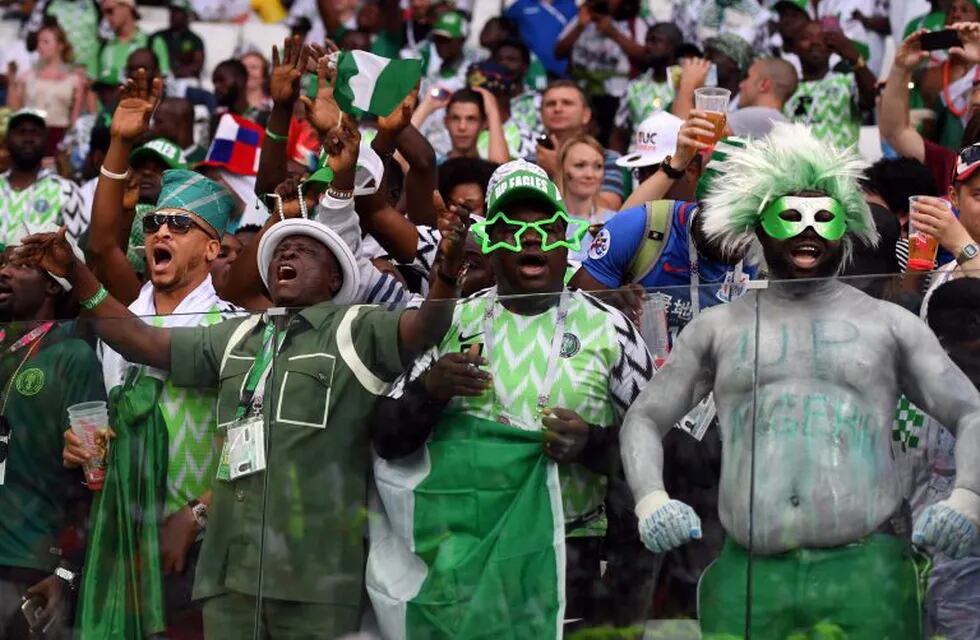 Nigeria's fans celebrate their victory at the end of during the Russia 2018 World Cup Group D football match between Nigeria and Iceland at the Volgograd Arena in Volgograd on June 22, 2018. / AFP PHOTO / Mark RALSTON / RESTRICTED TO EDITORIAL USE - NO MOBILE PUSH ALERTS/DOWNLOADS
